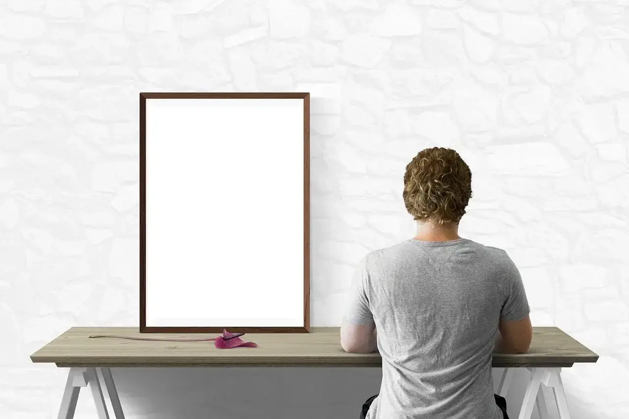 A person admiring a wall of posters