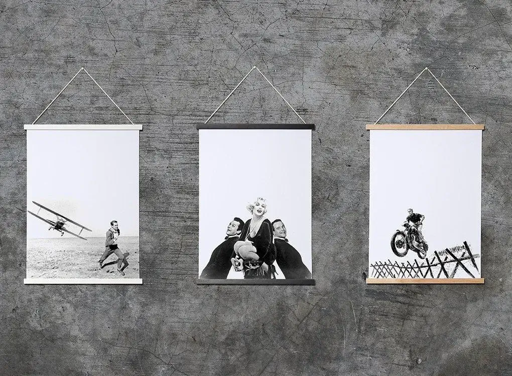 A framed poster hanging on a wall